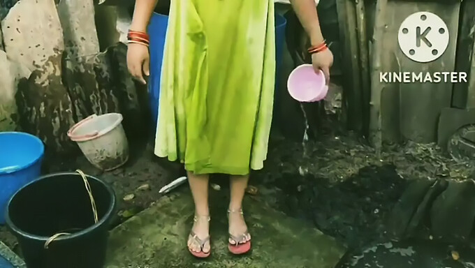 Outdoor shower with a muscular Indian aunty in a Tamil village