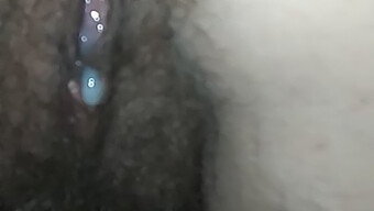 Close-up of white dotted penis cumming on pussy and bush in doggy style